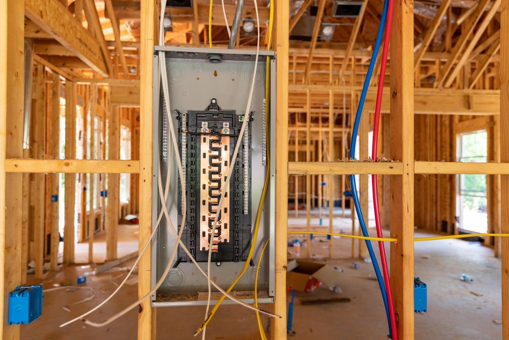 A view of an electrical panel in the middle of construction.
