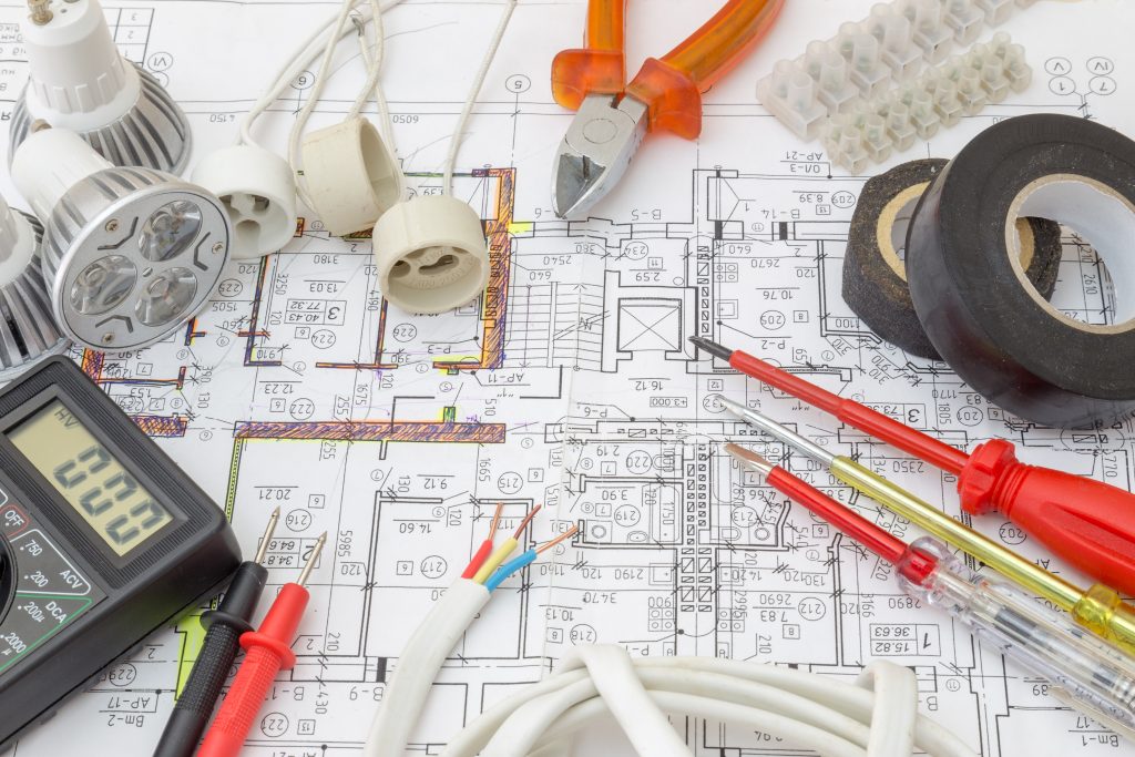 A bunch of electrical equipment sitting on top of a floor plan
